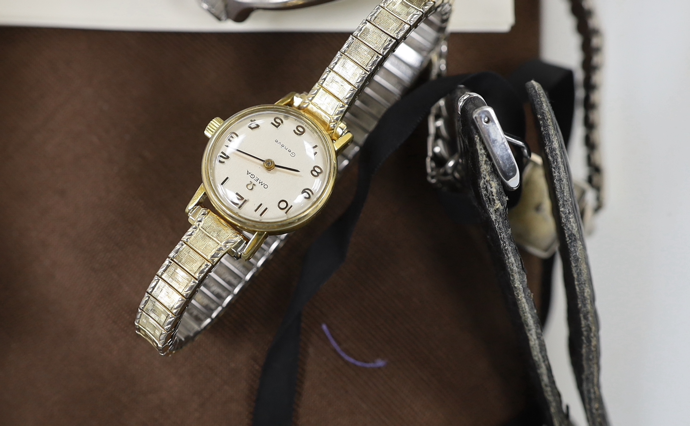 Two lady's steel or steel and gold plated Omega manual wind wrist watches (a.f.) six other assorted watches including gentleman's Marine Star and other minor items.